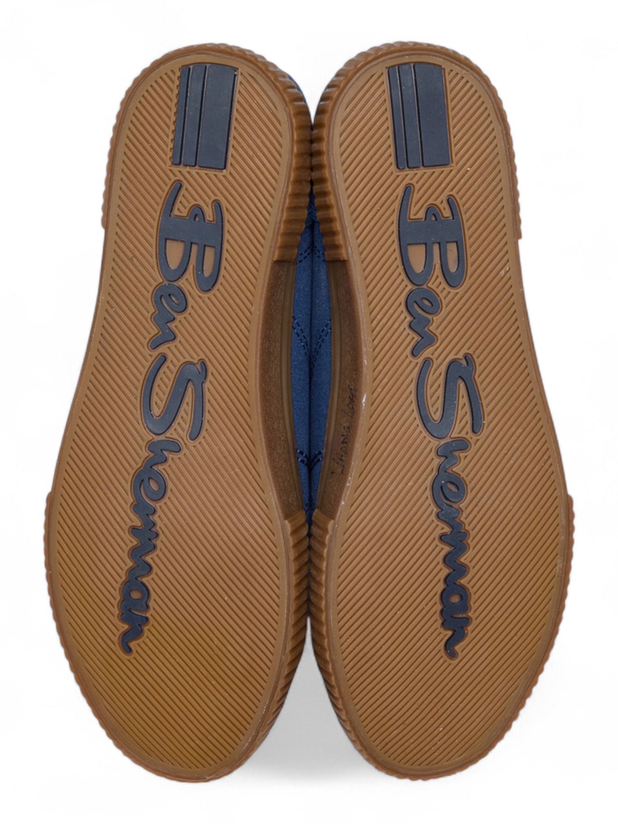 Brown shoe soles with 'Ben Sherman' branding on a white background