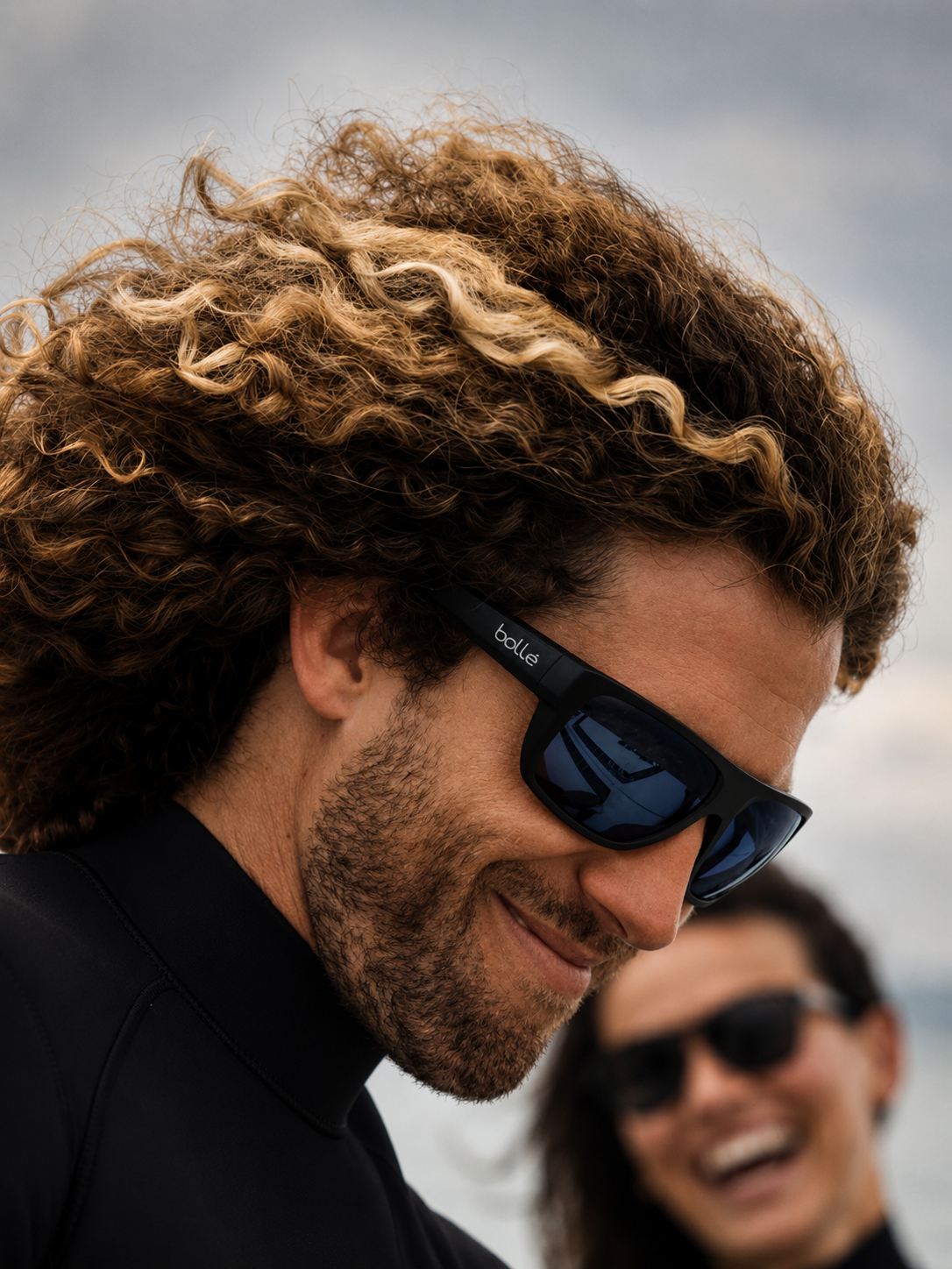 Man wearing sunglasses with a blurred background