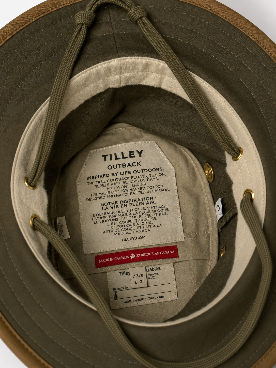 Close-up of a Tilley Outback hat with a label inside, showing brand details.