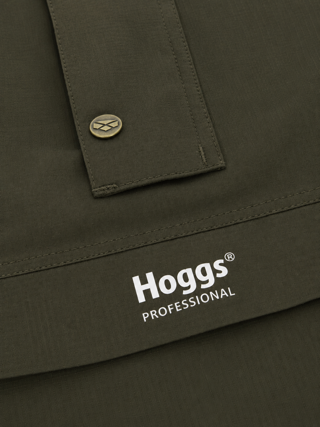 Close-up of a green jacket with 'Hoggs Professional' logo