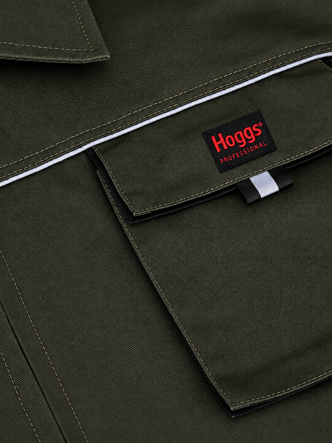 Green work overall with Hoggs Professional logo on a close-up of a pocket.