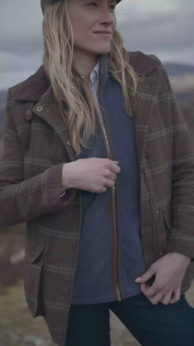 showing off outdoor clothing out in the country side 